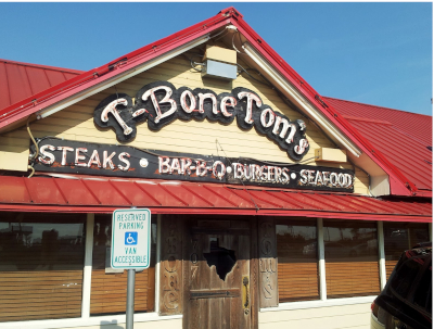 picture of front of restaurant with sign that says TBone Toms, also Steaks, Barbeque, Burgers and Seafood